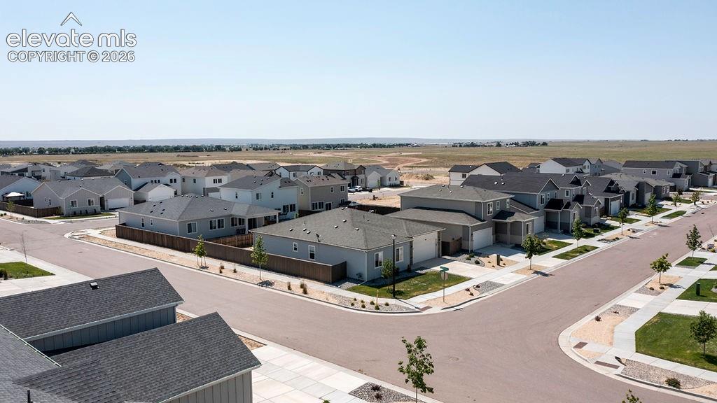 Aerial perspective showcasing a residential development with multiple single-family homes