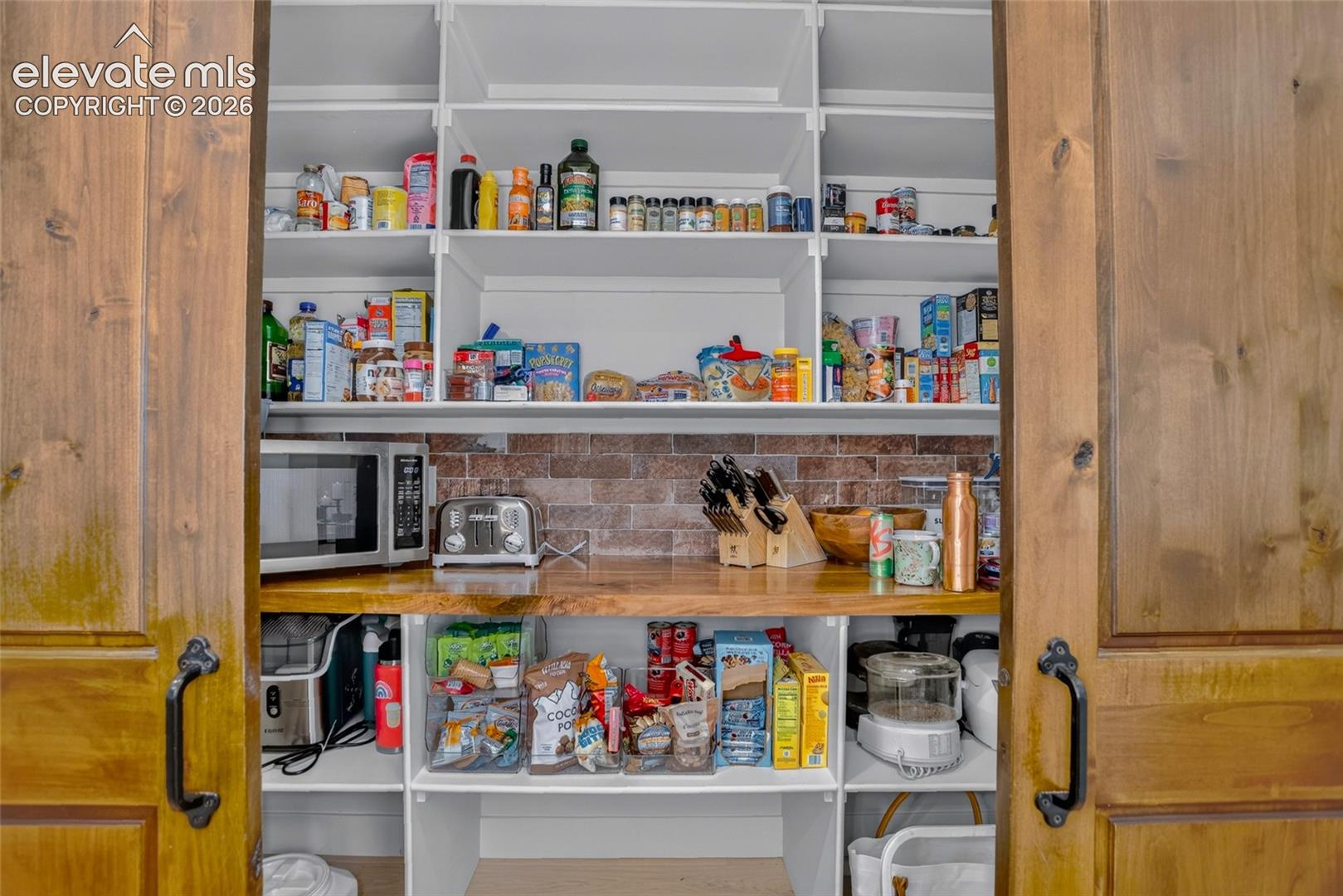 Barn-door pantry w/ built-in organization