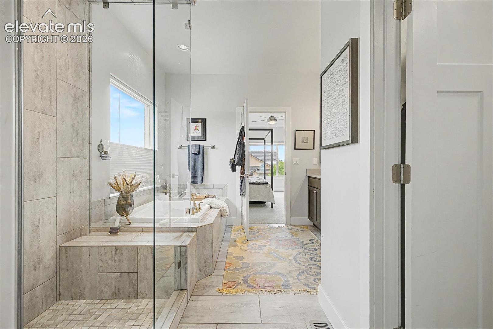 Another view of the gorgeous shower and large, soaking tub.