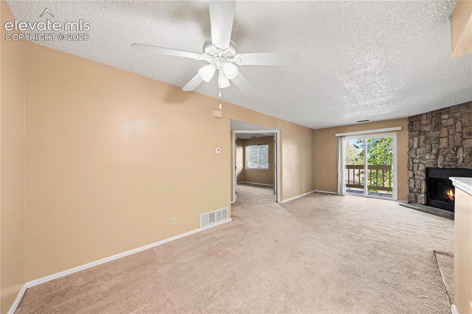 Carpeted interior with neutral walls