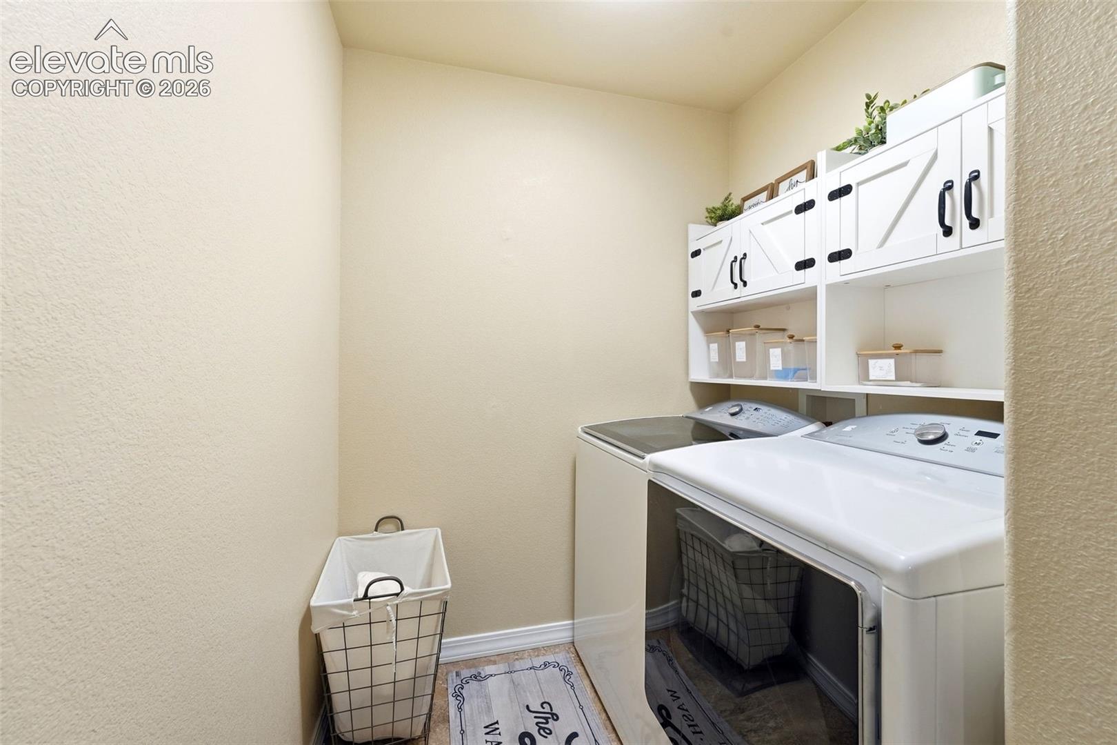 White shaker-style cabinetry with black hardware