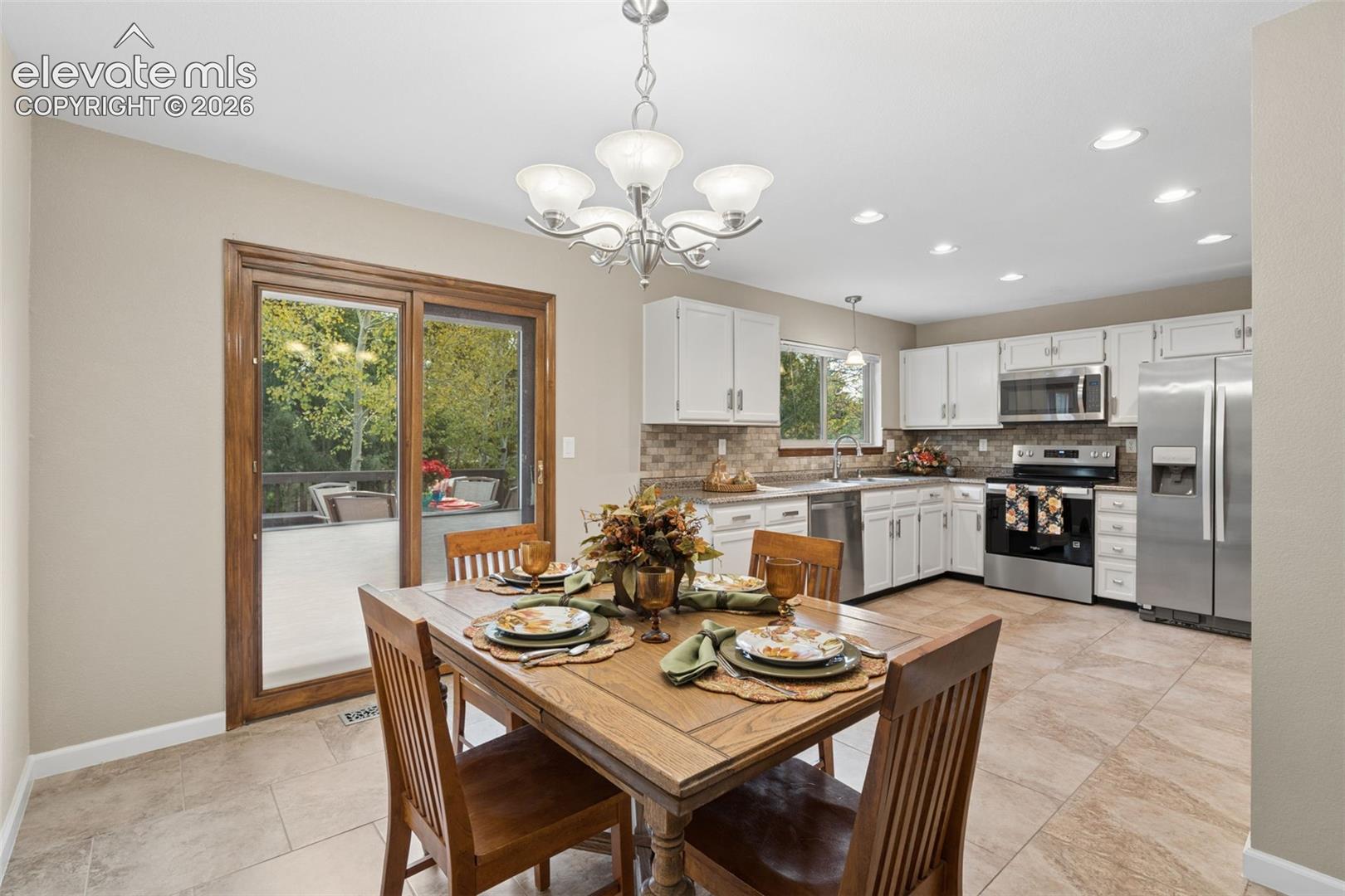 Large dining area with walkout to deck