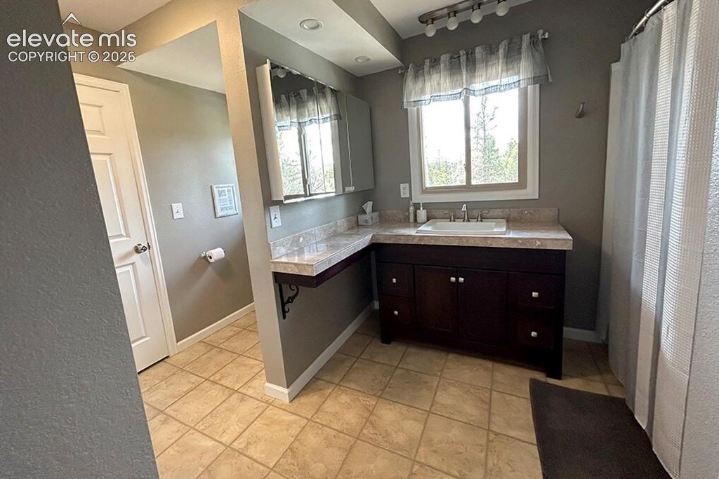Full, oversized, main floor bathroom. Attached to large main floor bedroom