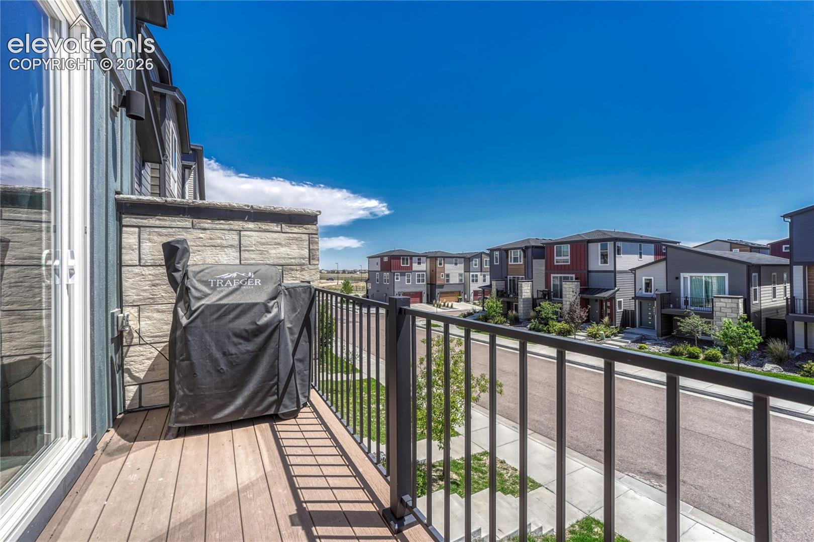 Composite material deck with metal railing. 
