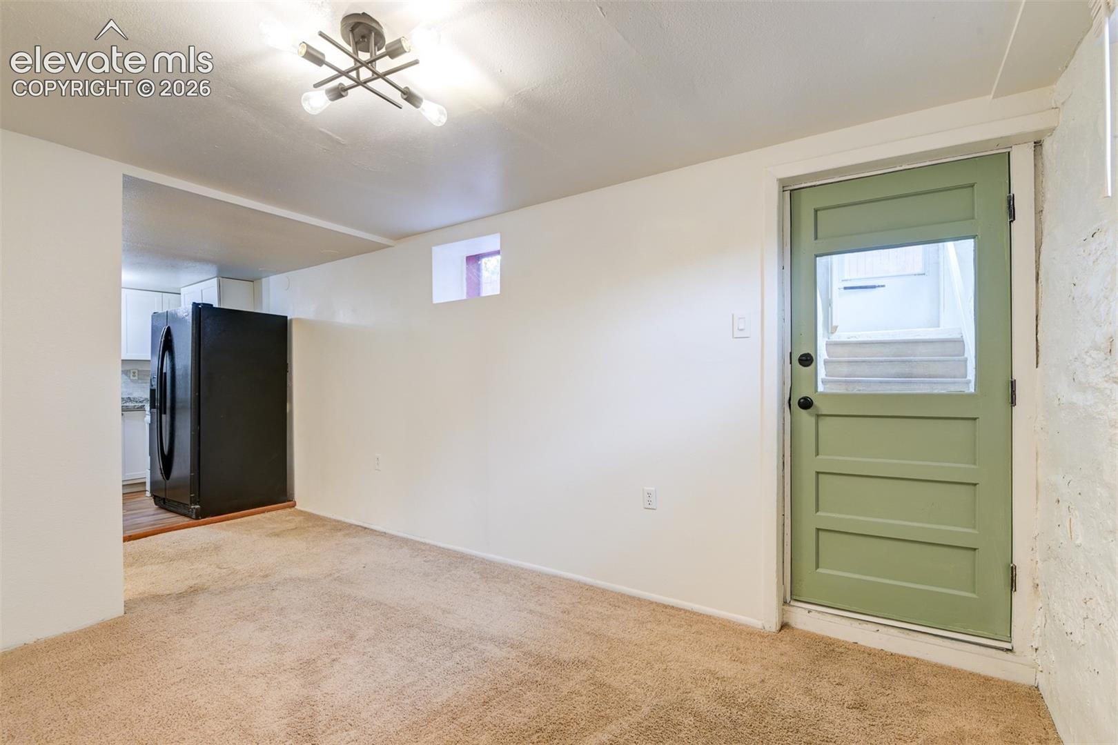 Basement unit located in the back of the property 