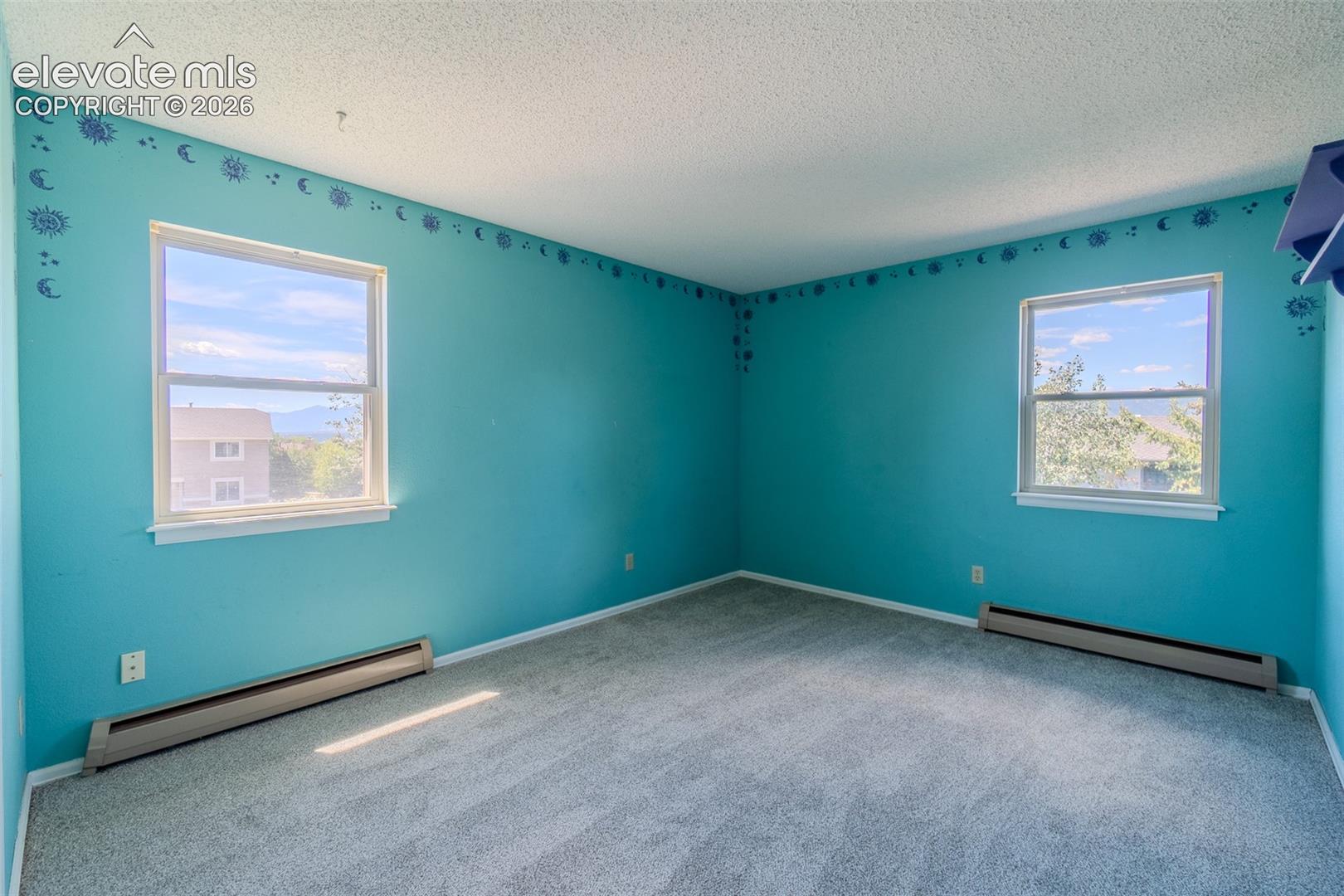 Three of Four upstairs bedroom with new carpet with two large windows