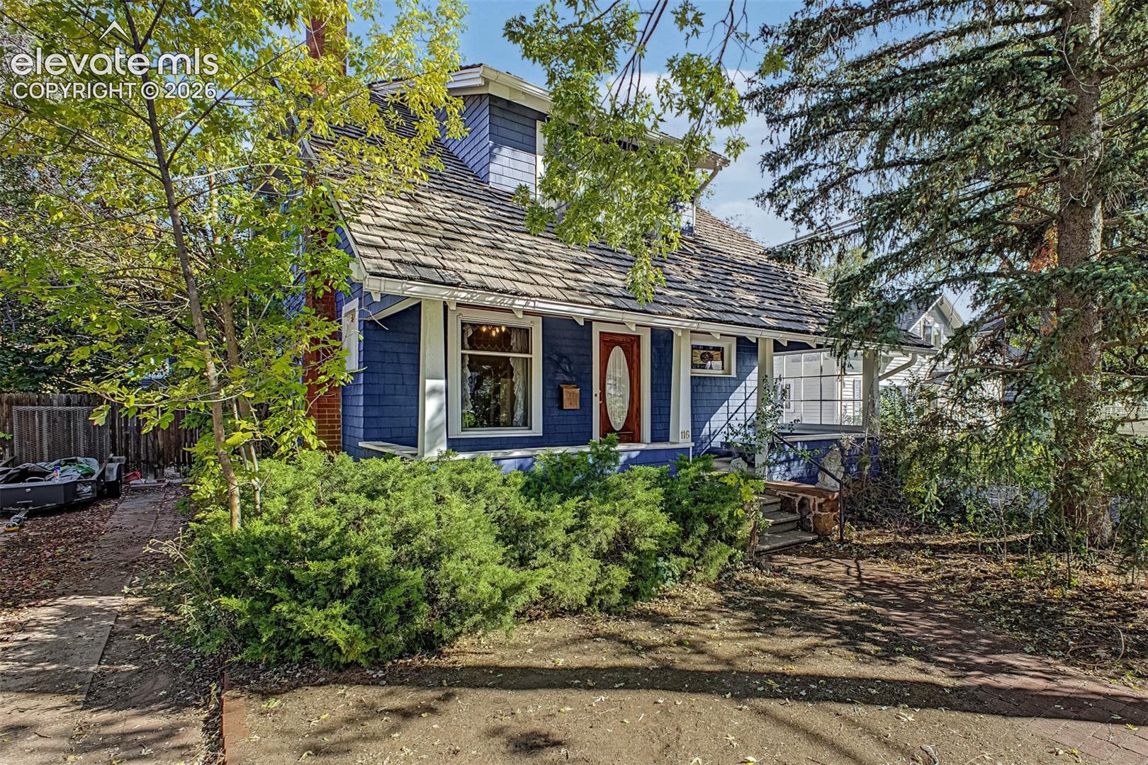 Built in 1917 this classic Old North End home radiates Charm and Character. As you walk through the front door, you're greeted by natural light, original hardwood floors and beautifully appointed woodwork and carpentry that flow throughout the house. The living space features a fireplace and original built in's that add to the charm and character of this home. A bedroom or flex space is located just off the living area to add options to this home. An ample sized kitchen, mud room, pantry, laundry room with a 1/2 bath complete this level. Head upstairs to four spacious and light drenched bedrooms (1 non conforming), with large closets, full bath with clawfoot tub. Outside, enjoy the fully fenced private backyard and additional studio living space, additional off-street parking easily accessed to the side of the home. Enjoy changing views throughout the seasons going from a shady tree-lined street in Summer and fall colors. This home is in a sought-after neighborhood and is close to schools, walking trails, parks, shopping, restaurants and is steps away from a neighborhood coffee shop.