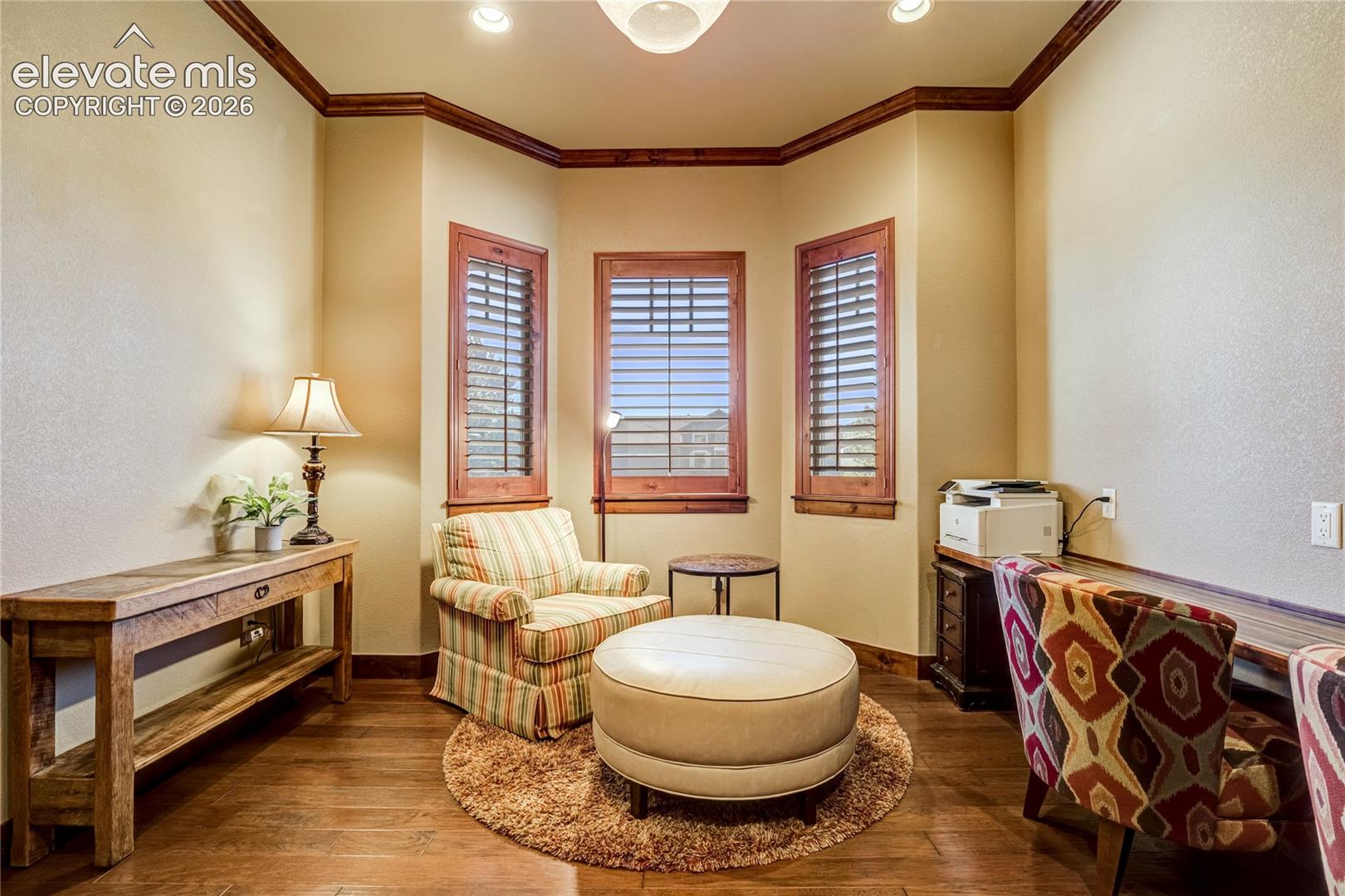 A cantilevered bay window creates a charming sitting area within the dedicated study, while crown molding, engineered wood flooring + natural light establish a polished environment for work or creative pursuits.