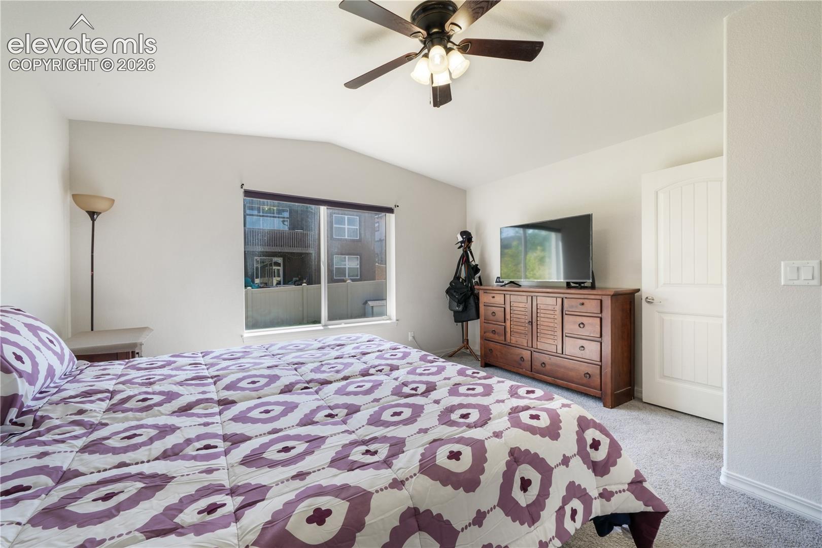 Main level primary bedroom with ensuite 5 piece bathroom with granite counters, large walk in closet and new carpet