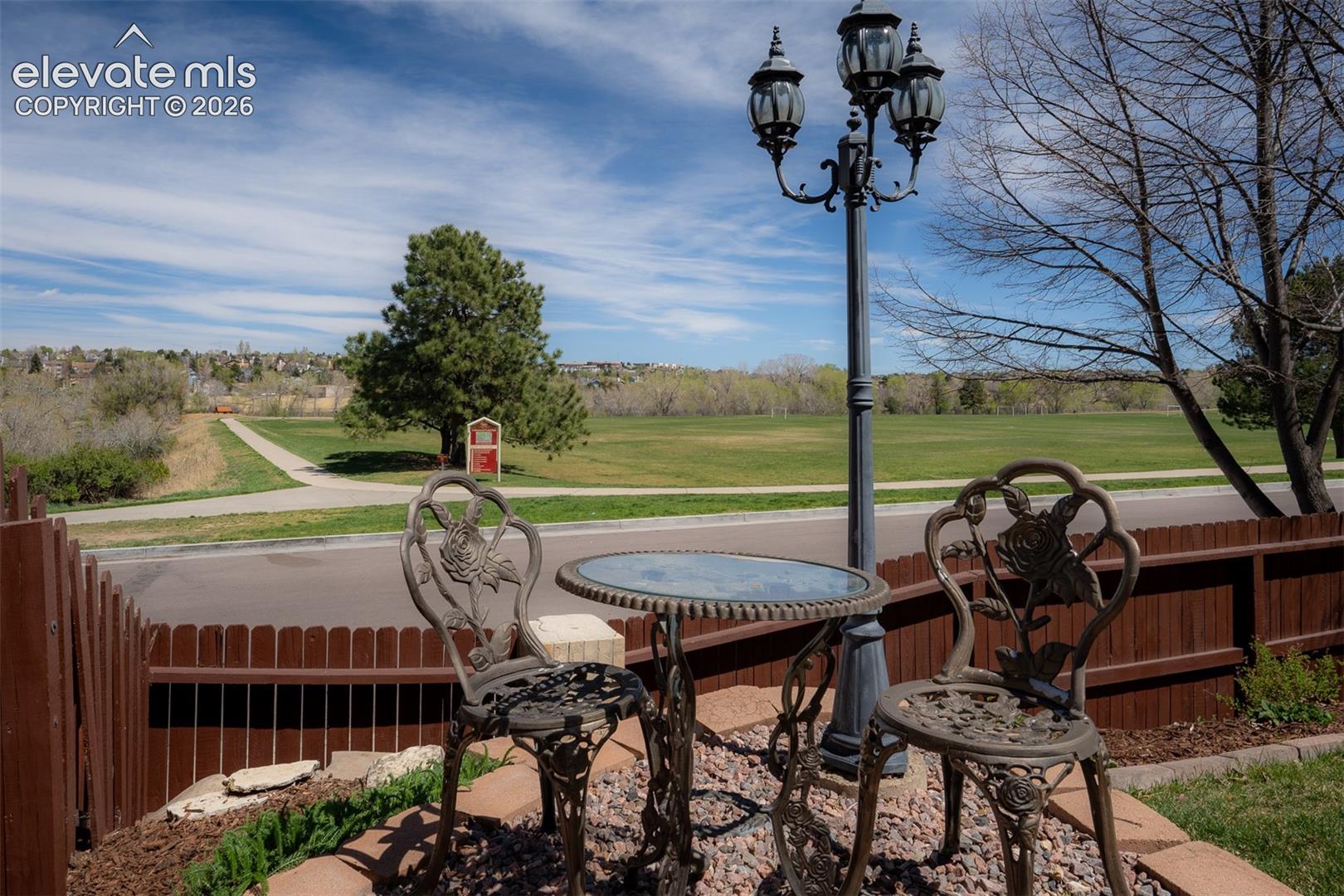 Street lamp, table and chairs.  Perfect for romantic afternoon or evening cheers.