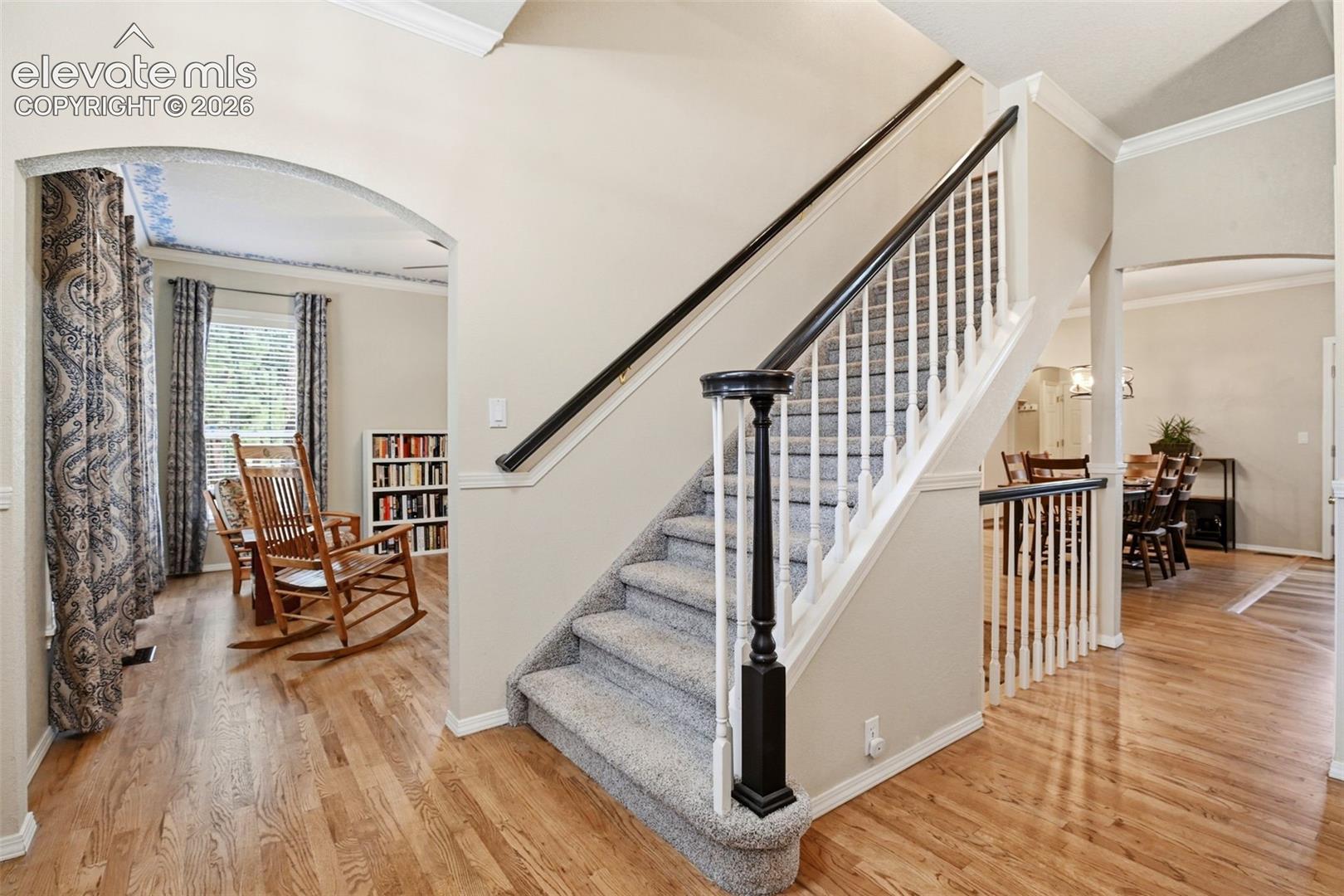 Front entry and arched doorway opens to the dining room on the left