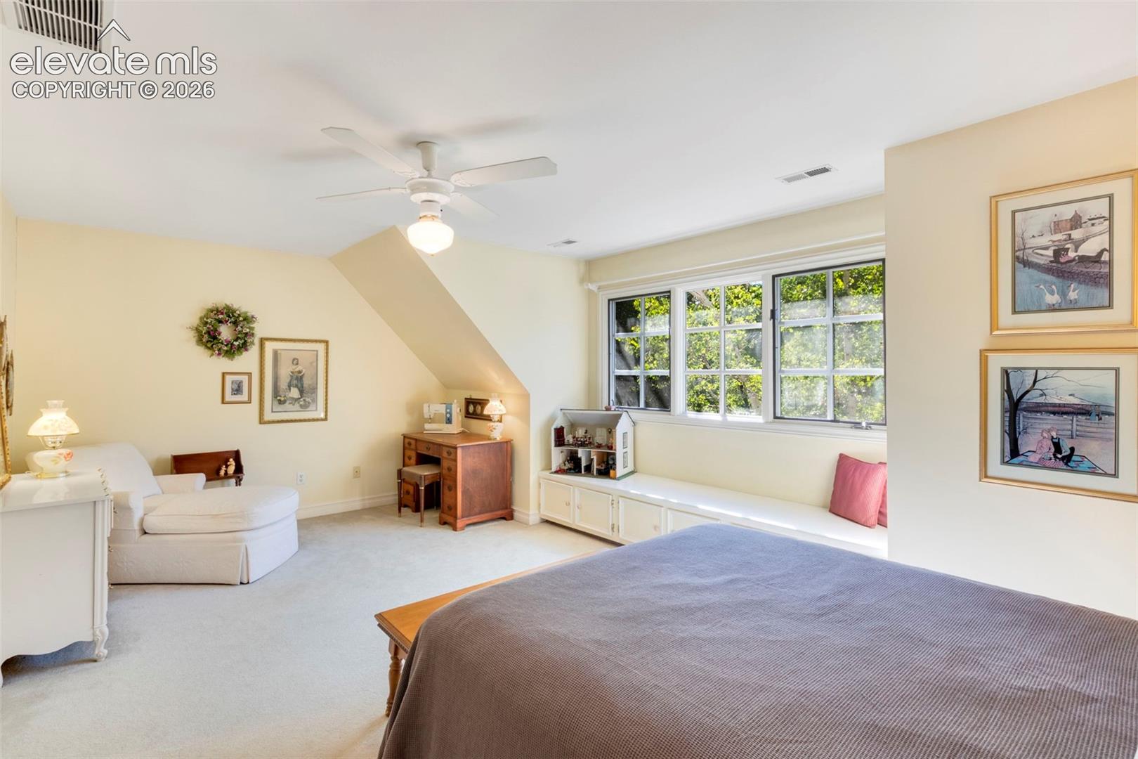 Upstairs bedroom with built-in reading bench