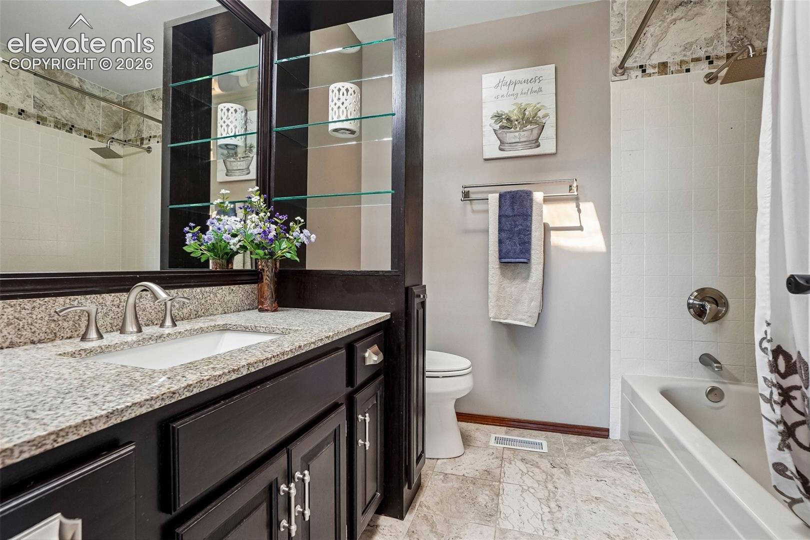 Hall bathroom serves three other bedrooms upstairs.