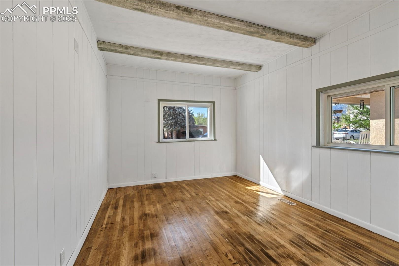 White Bedroom with hardwood floors