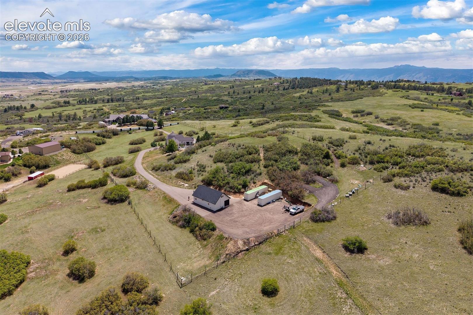 The fully fenced acreage, with coyote-proof game fencing, is ready for grazing animals. 