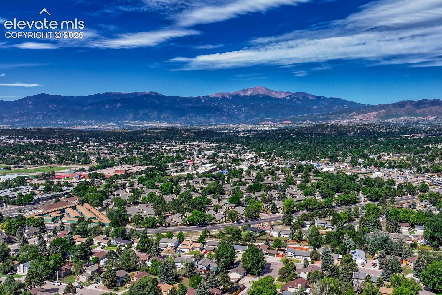 Aerial view of neighborhood with fabulous mountain and Peak views!