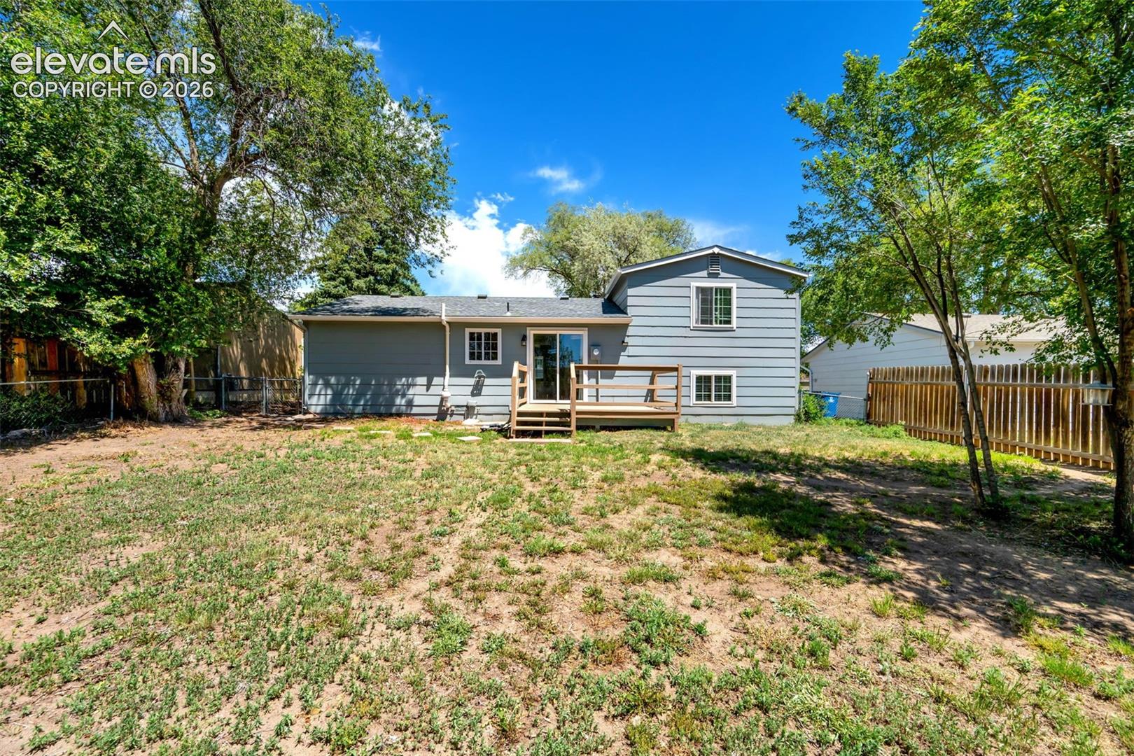 Charming single-family residence with vinyl siding exterior and covered front porch entry