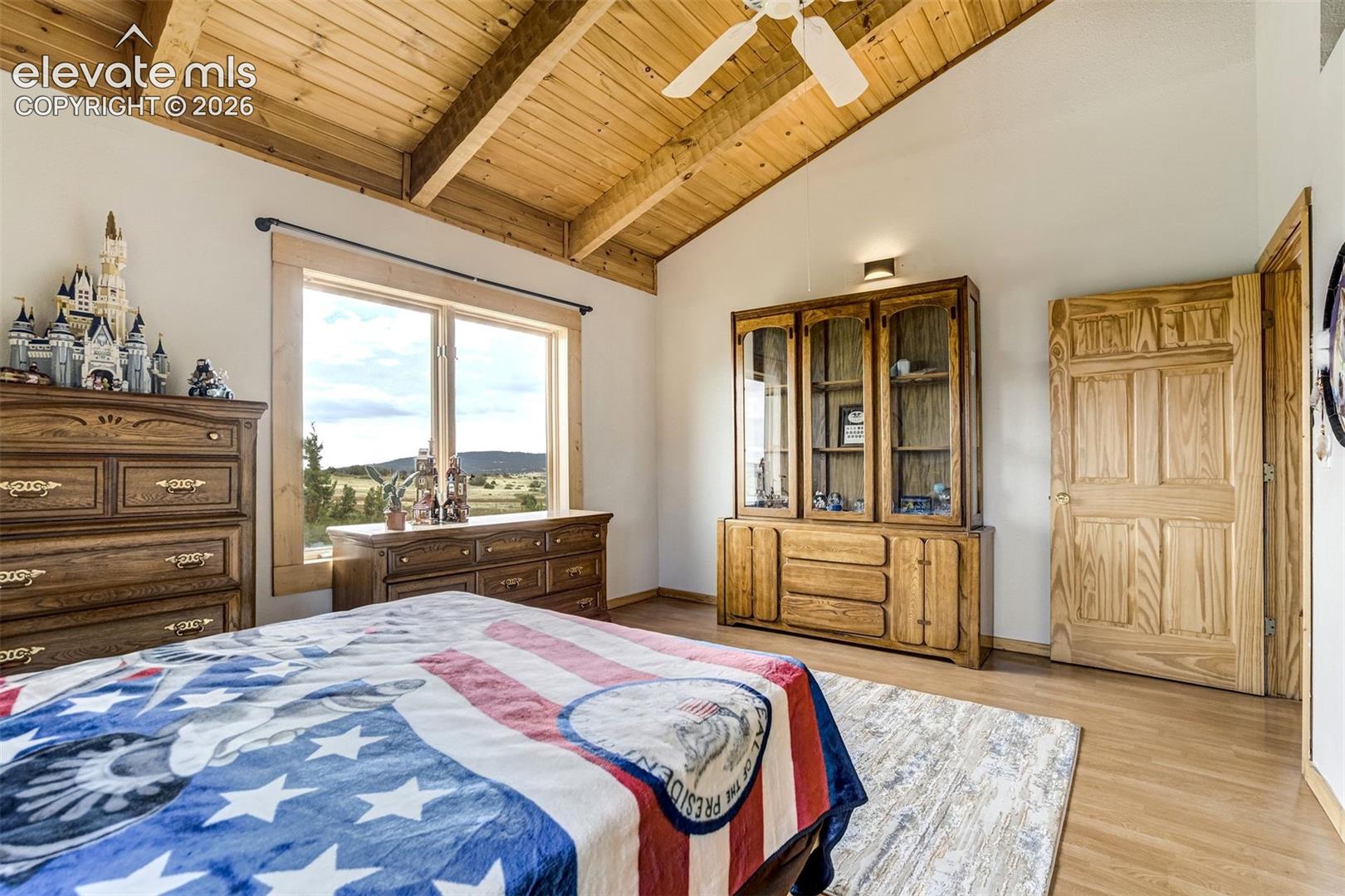 Vaulted wood-paneled ceiling with exposed beams