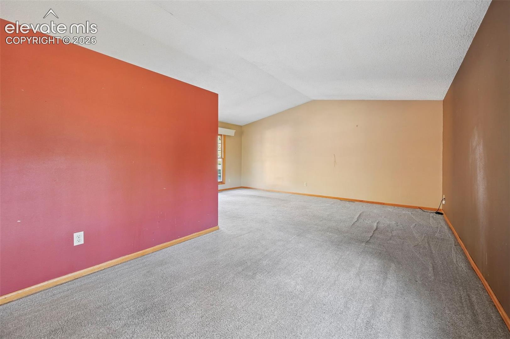 Wall-to-wall carpeting and sloped ceiling