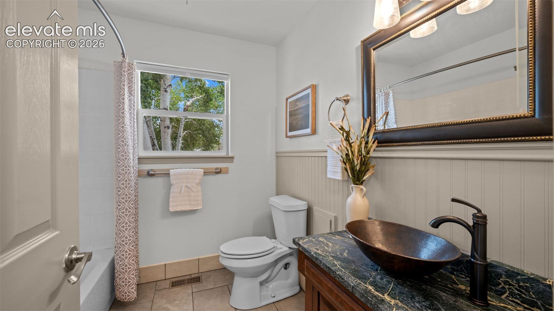 Full bath right off the entry with a beautiful copper vessel sink!