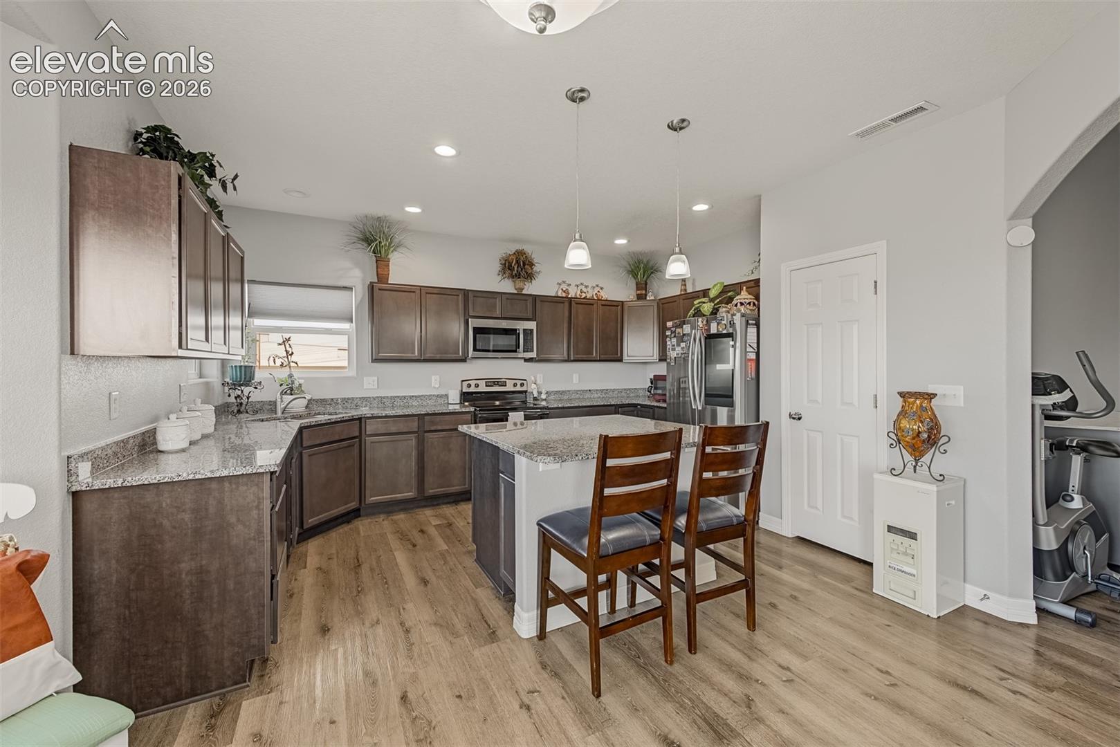 Enjoy the holidays in your gourmet kitchen featuring a large island and built-in microwave.