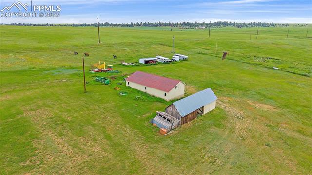 Aerial view of sparsely populated area featuring a pastoral area