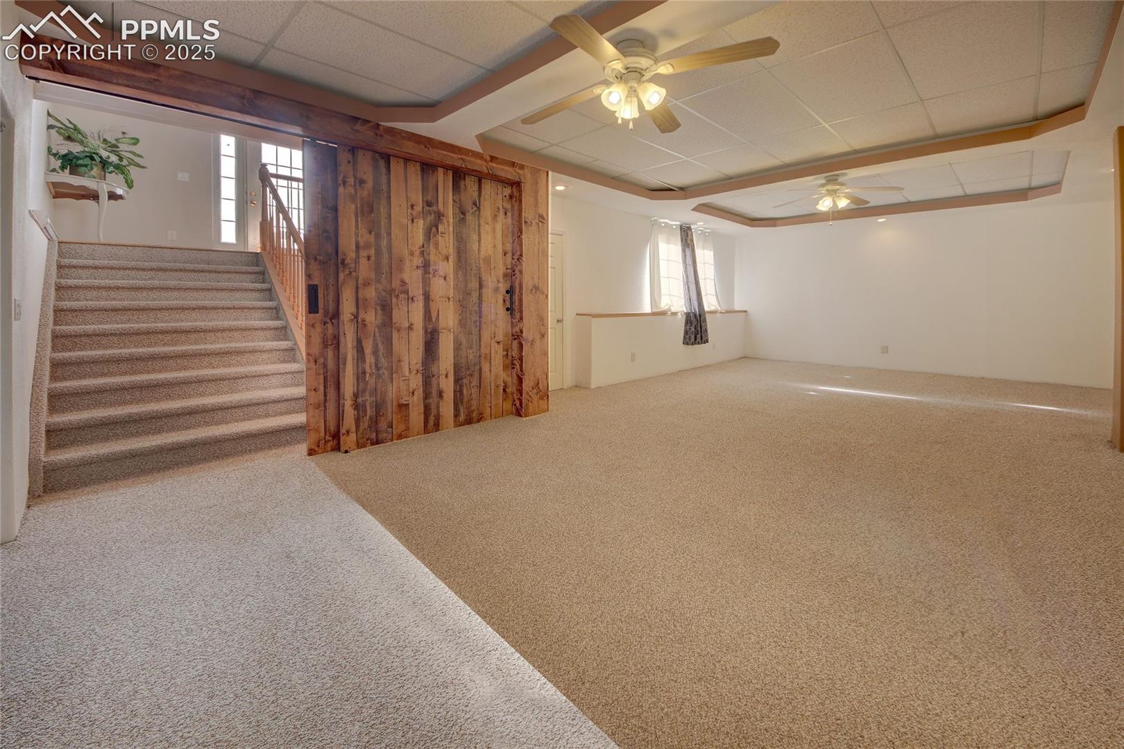 Barndoor entry to basement family room