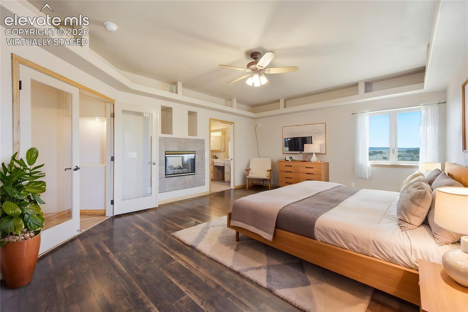 Primary Bedroom with walkout to deck (virtually staged)