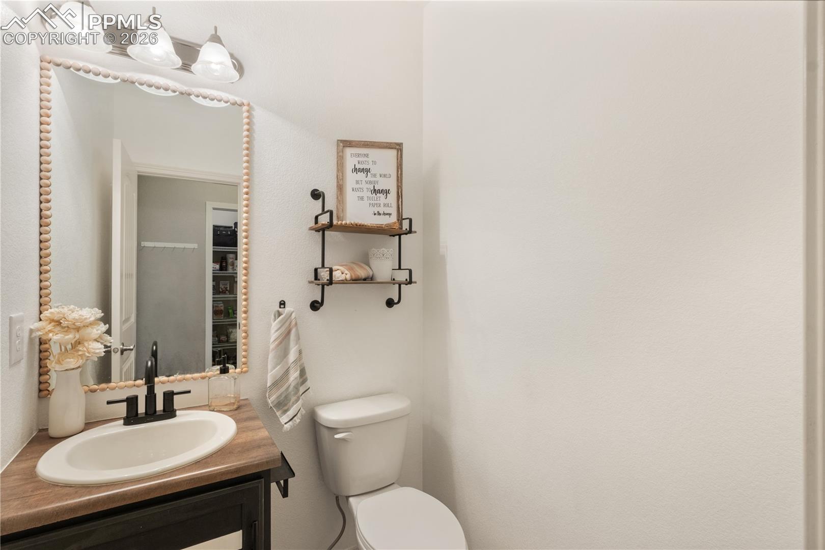 Bathroom featuring vanity and toilet