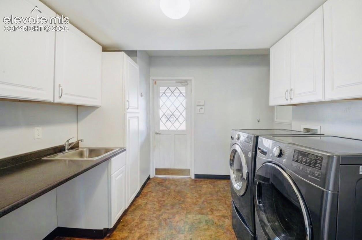 Large Custom Laundry Room with Tons of Cabinets for Storage.