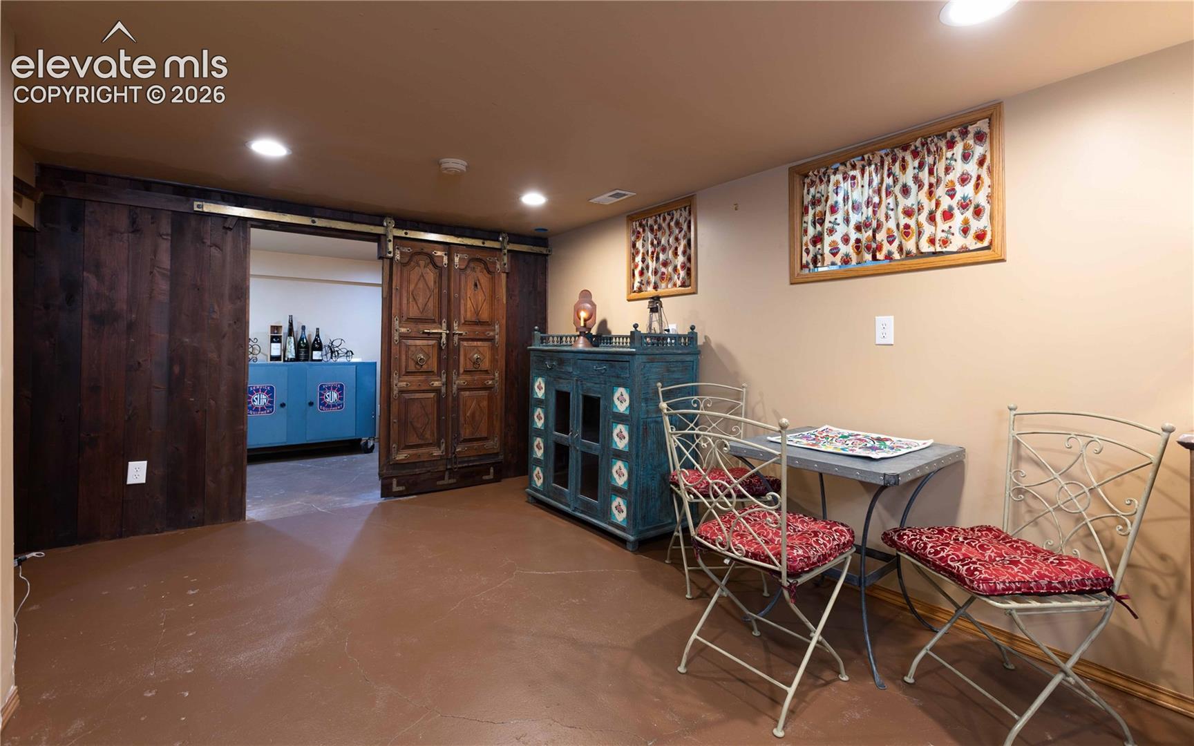 Gorgeous authentic barn door from north Africa closes off the storage area