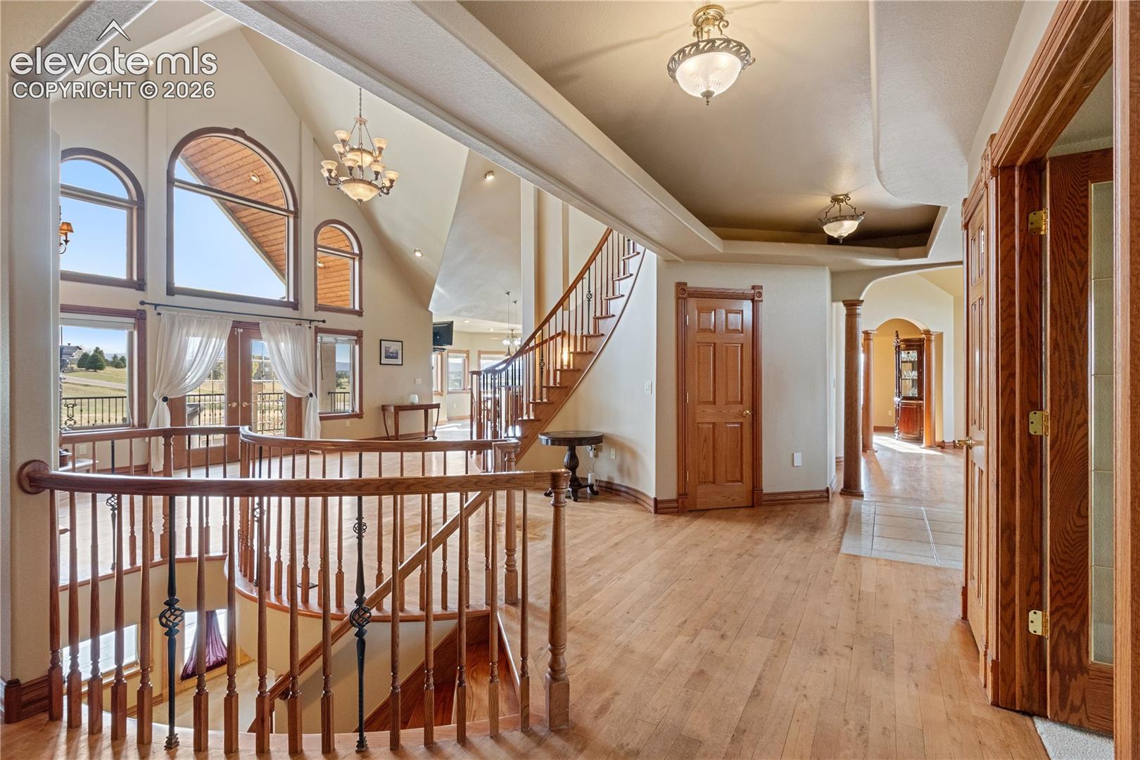 Entryway and family room, door to 1/2 bathroom, stairs just in front down to basement