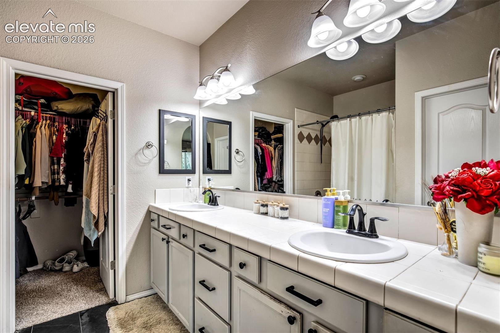 Double vanity in the primary bathroom and walk-in closet 