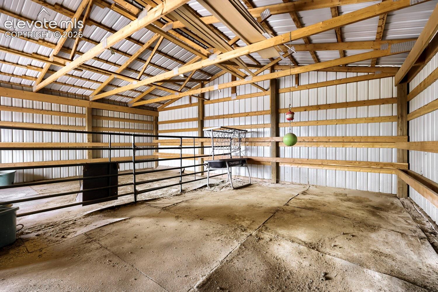Second stall equipped with  heated watering device, hay feeder and 4H hoof padding.