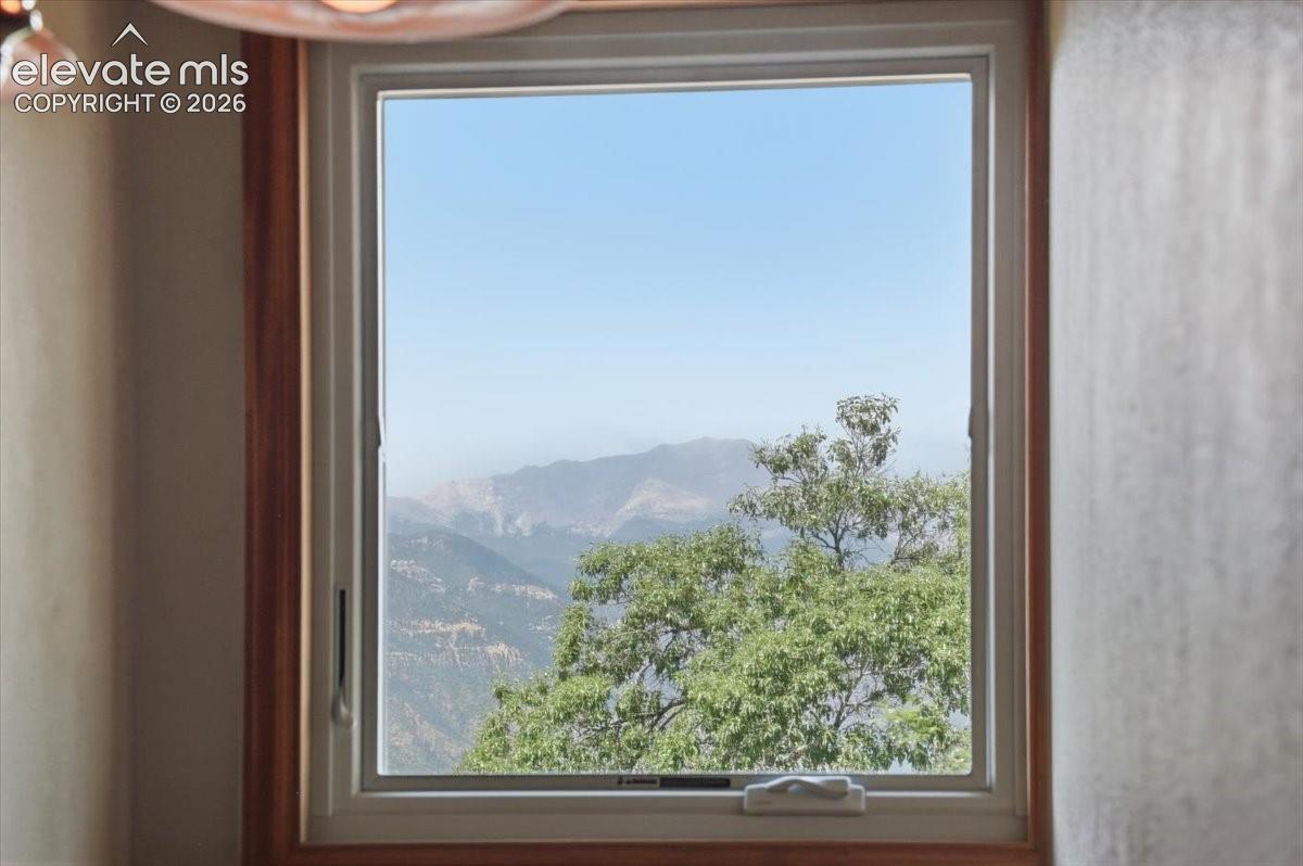 Pikes Peak view from the window at the top of the stairs