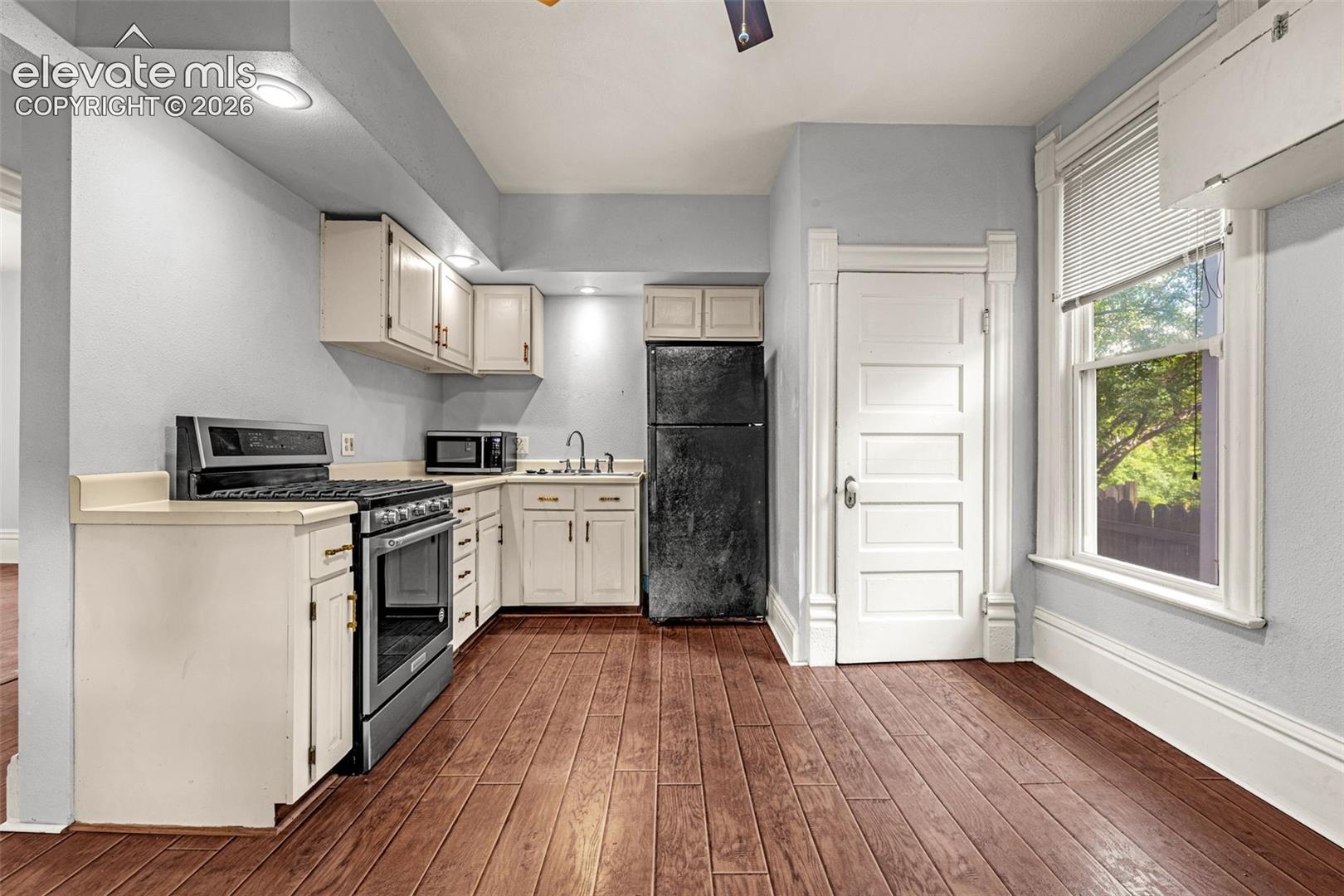 Main level unit, solid wood flooring, 