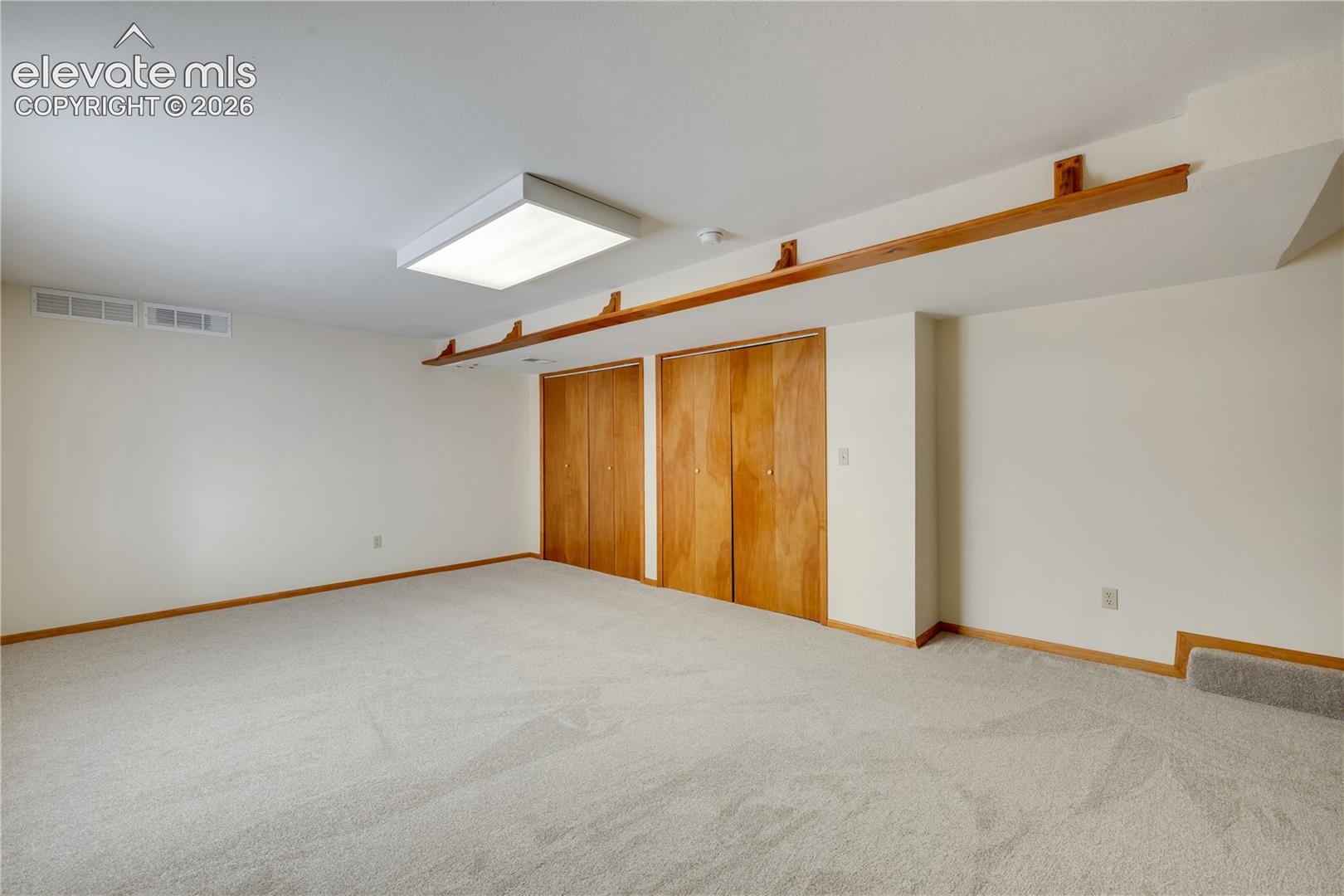 Double closets in basement family room with lots of storage or this large area could be a playroom or media room