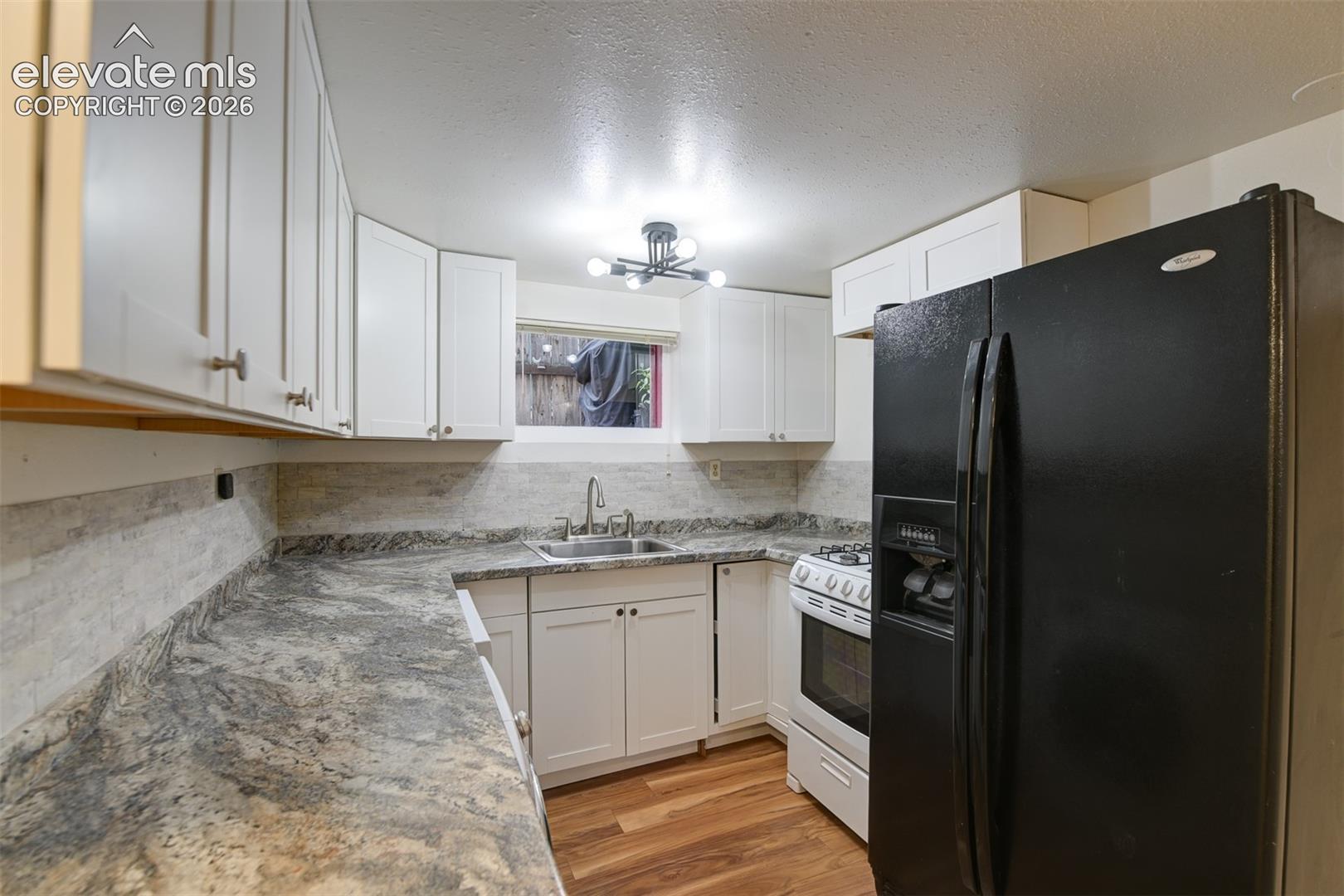 Basement unit located in the back of the property 