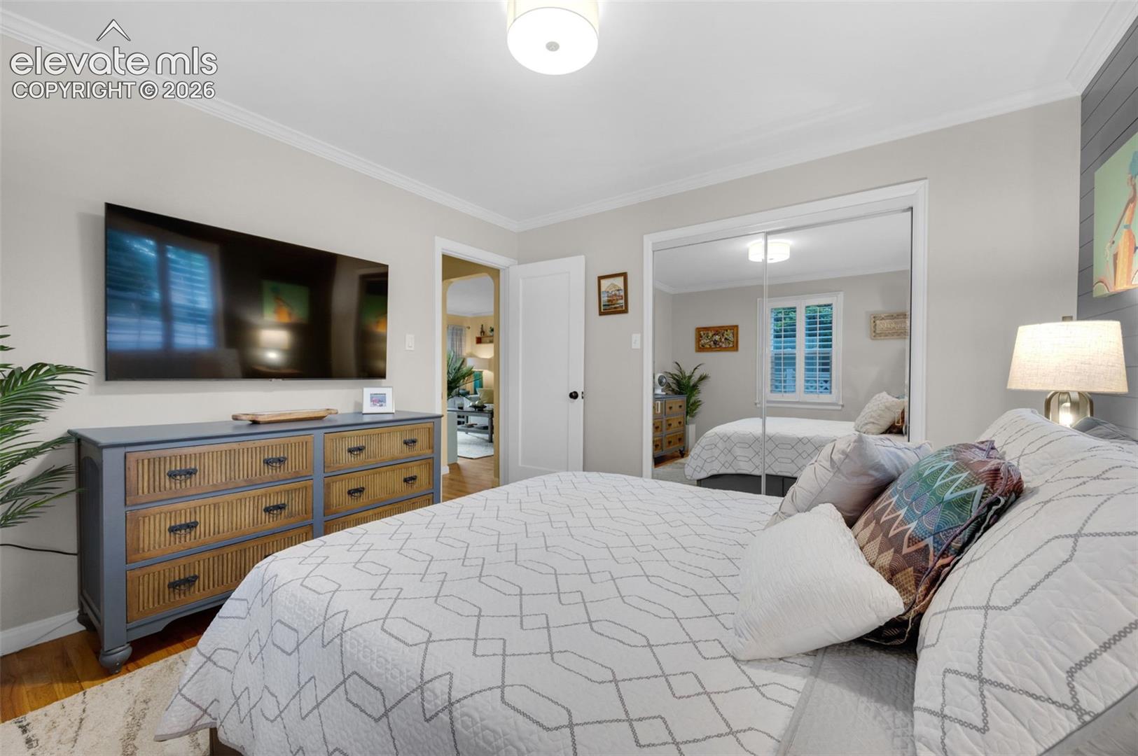 Main bedroom with mirrored walk in closet