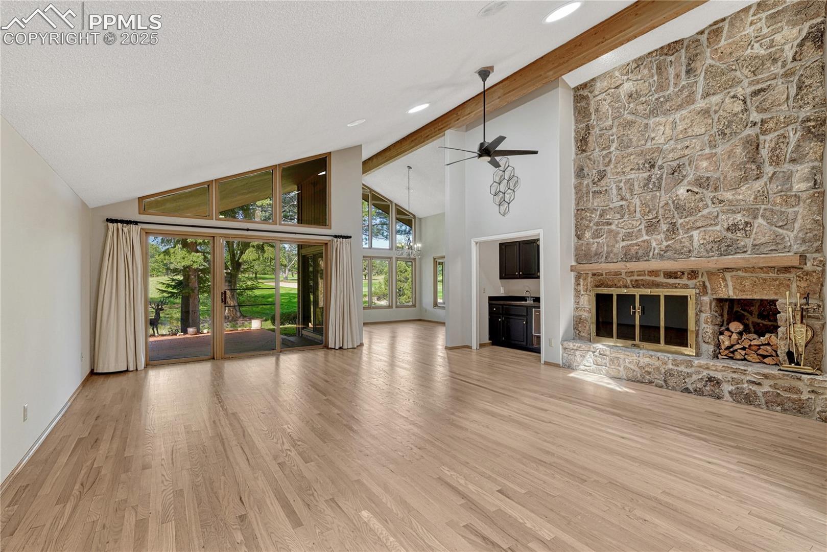 Vaulted Ceilings, Large Moss Rock Stone Fireplace