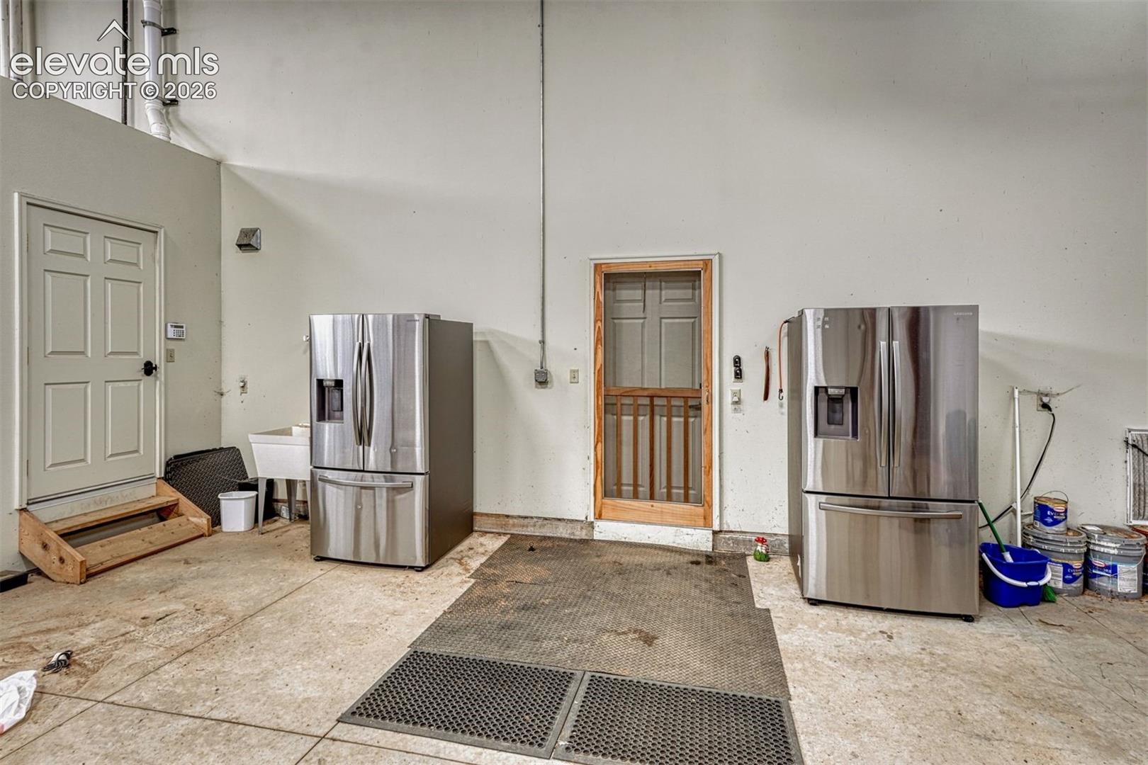 2 stainless steel refrigerators and slop sink will remain just as your about to step inside