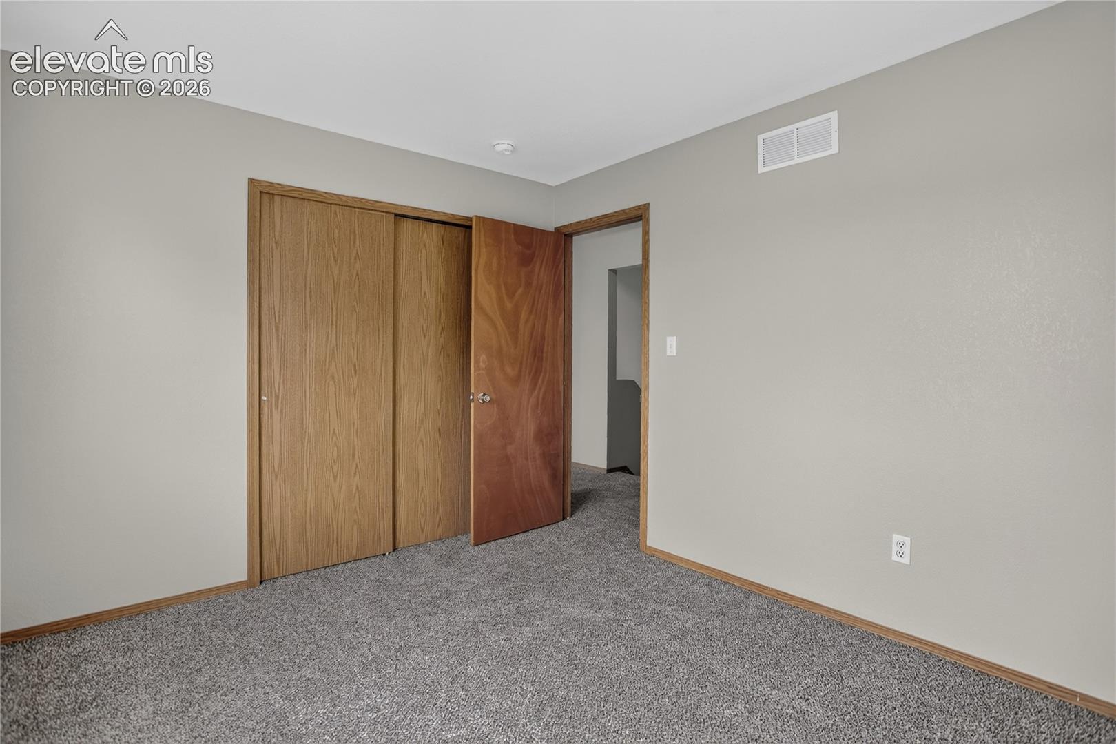 Gray carpet flooring with light gray wall paint