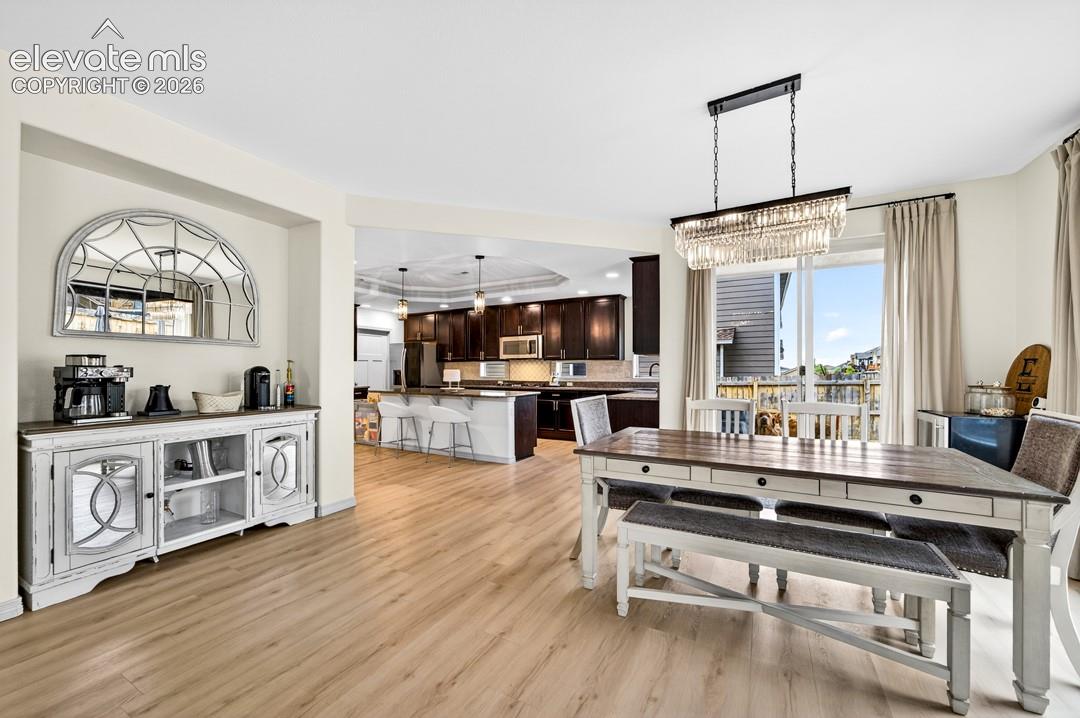 Luxury vinyl, chandelier, kitchen, dinning room
