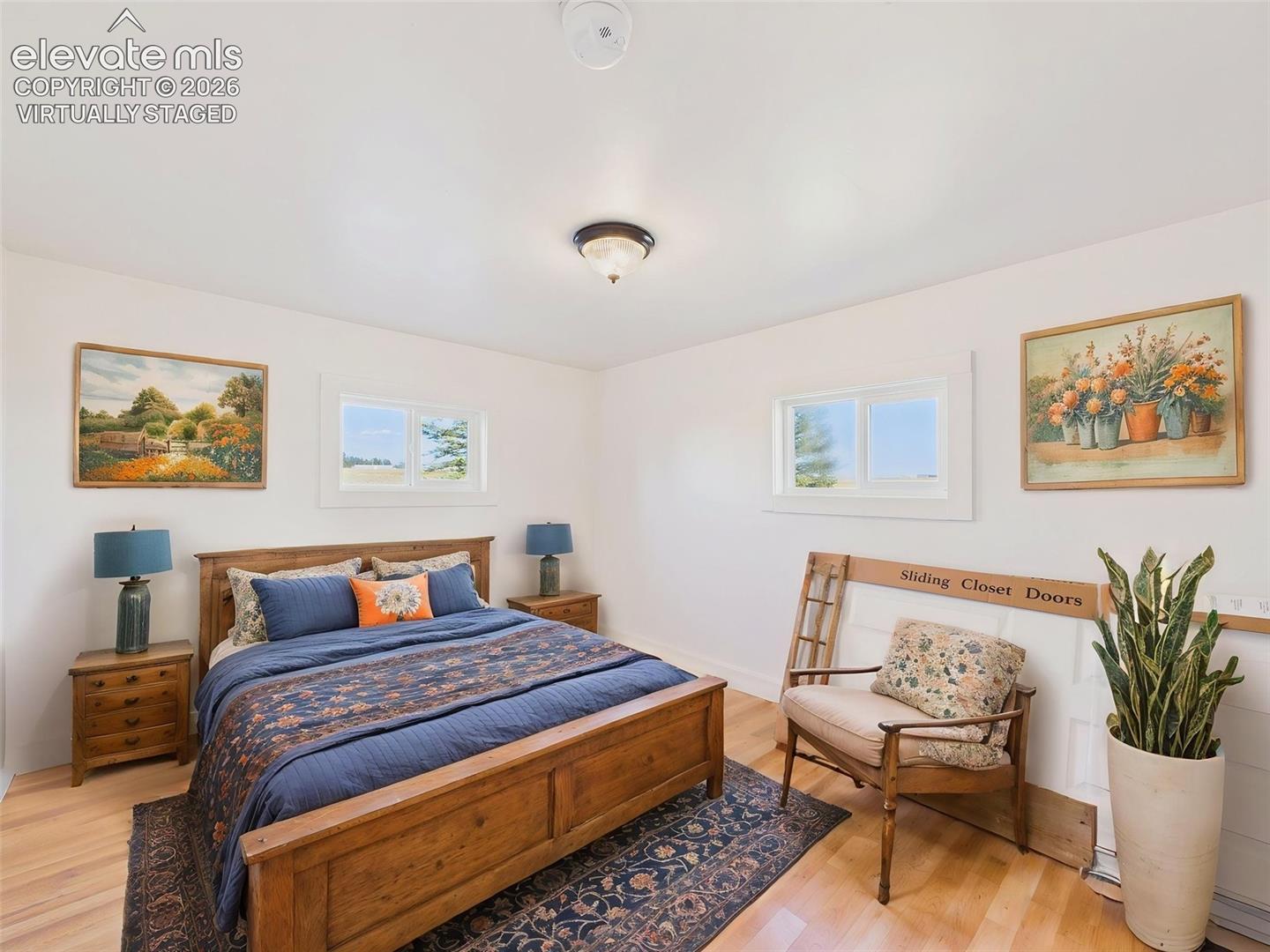 (Virtually Staged) Secondary Bedroom – Comfortable secondary bedroom features new flooring, natural light, and ample space for family, guests, or a home office.