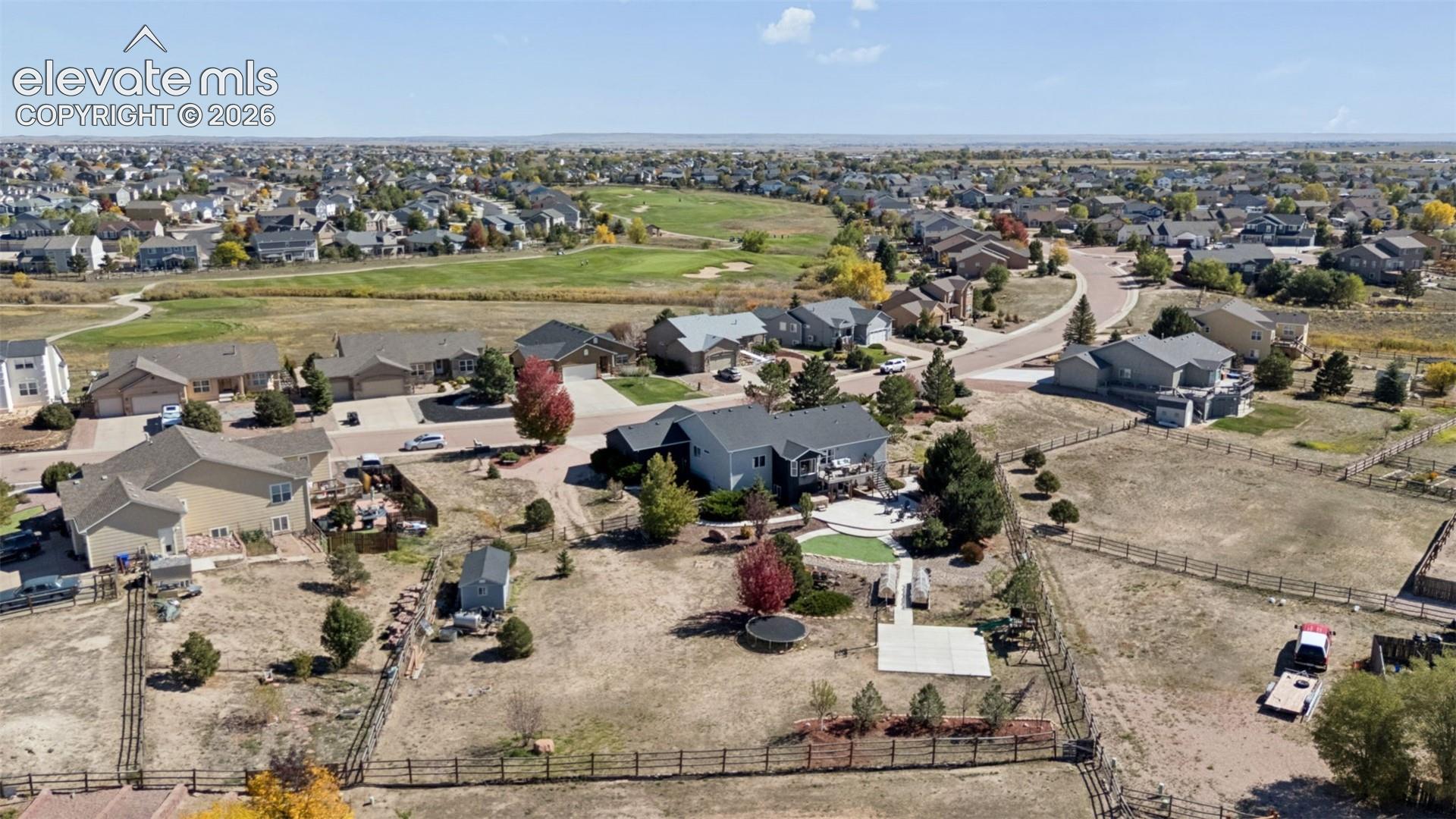 Expansive property with a fenced backyard, an in-ground pool, and mature trees