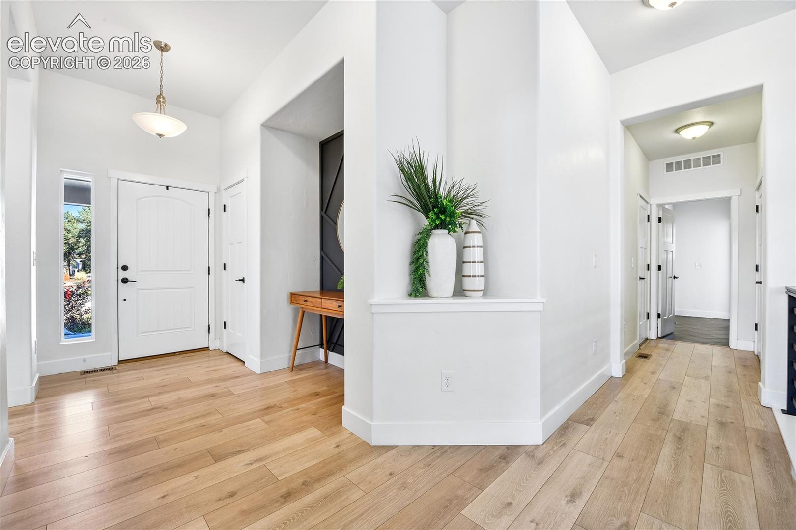 Laundry access off door to 3 car garage, as well as entry