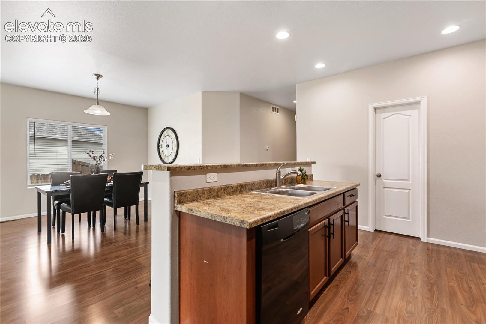 The kitchen features this island with breakfast bar.  There is also a walk-in pantry!