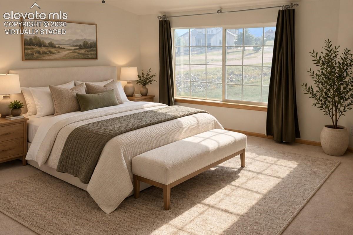 Upstairs bedroom 1/3 w/ large walk-in closet. Expansive window with mountain views offering abundant natural light. Virtually staged.