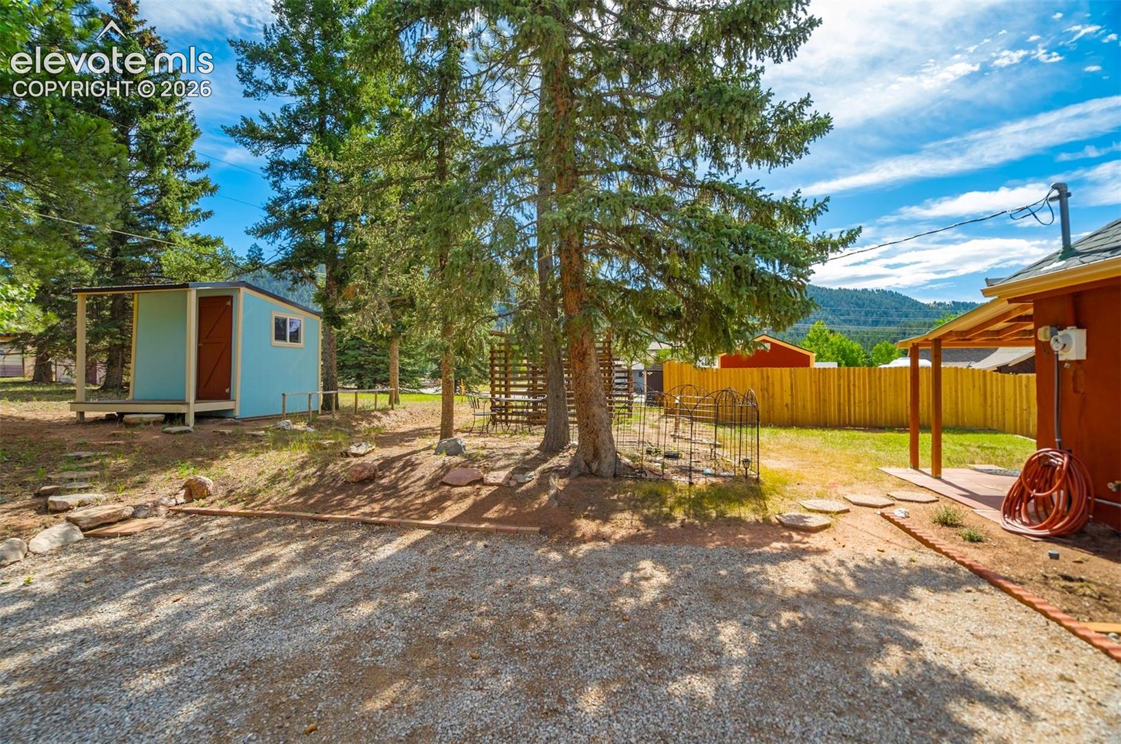 Yard with patio area and storage shed