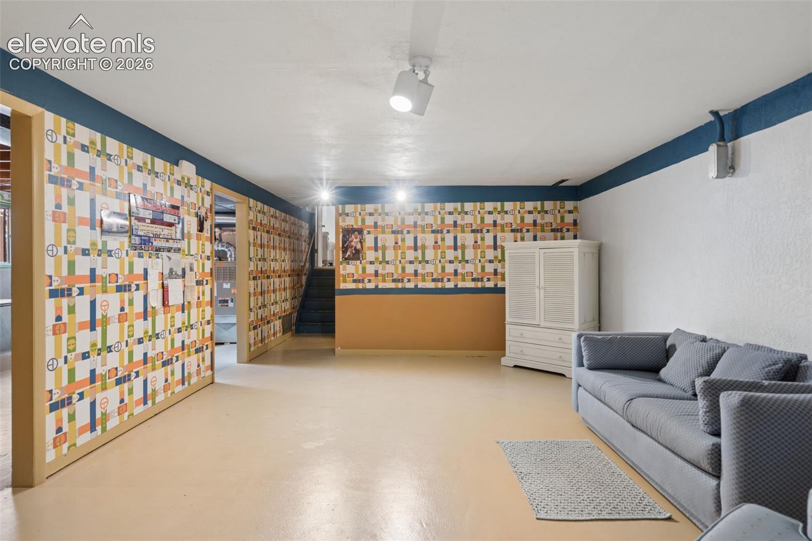 Basement bonus area that could double as an exercise room, game room or play space 